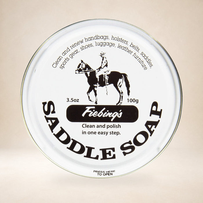 Fiebing's White Saddle Soap 3.5 oz on a warm studio background