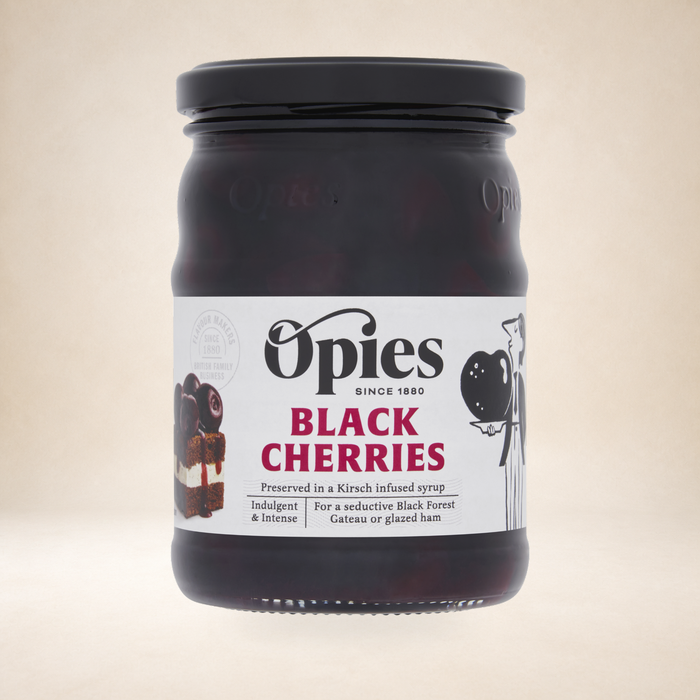 Opies Black Cherries 370g on a warm studio background