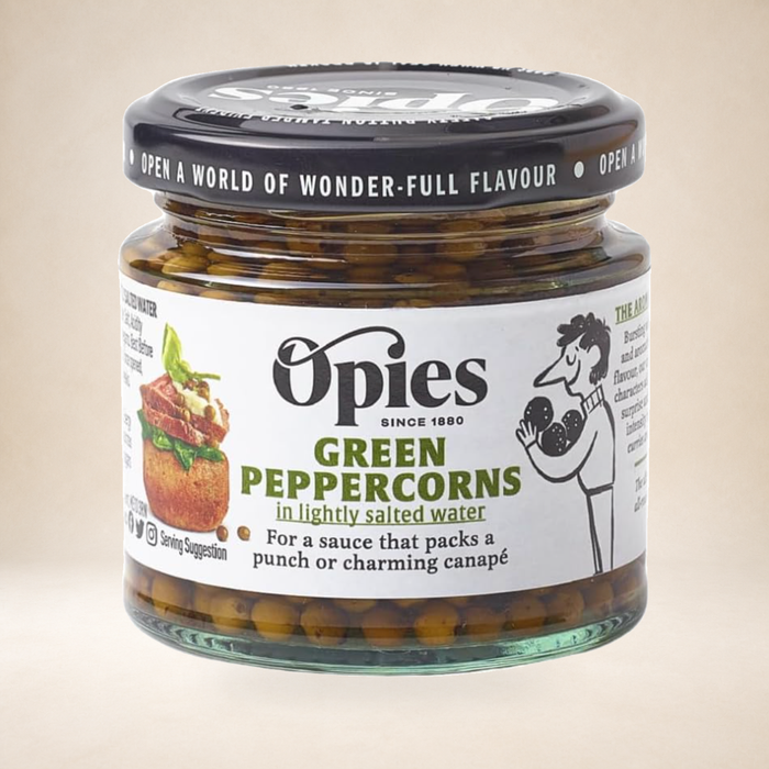 Opies Green Peppercorns 115g on a warm studio background
