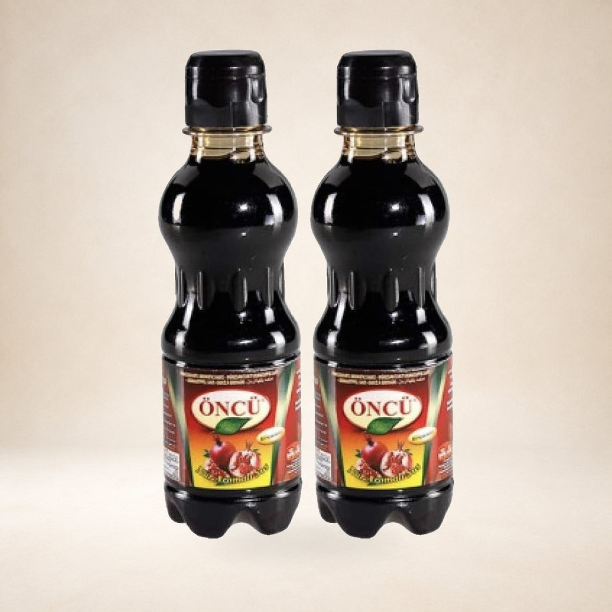 Öncü Pomegranate Molasses on a warm studio background