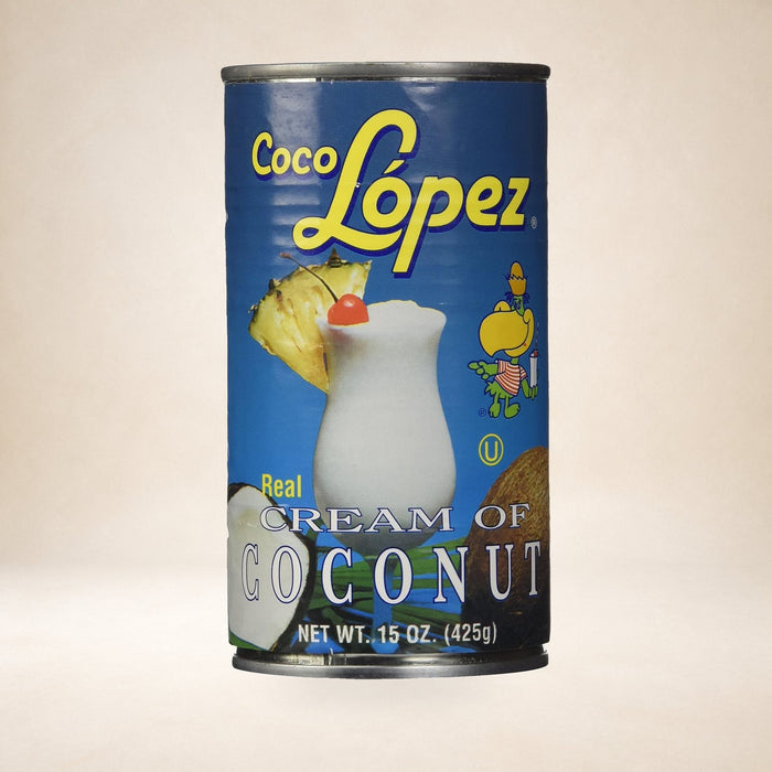 Coco Lopez Coconut Cream 425g on a warm studio background