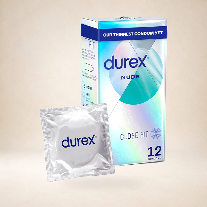 Durex Nude Close Fit Condoms, 12 Pack on a warm studio background