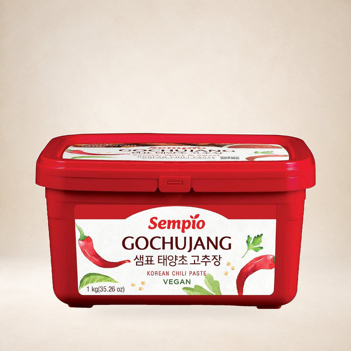 Sempio Korean Hot Pepper Gochujang Paste 1kg on a warm studio background