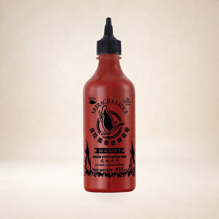 Flying Goose Blackout Sriracha Chilli Sauce 455ml on a warm studio background