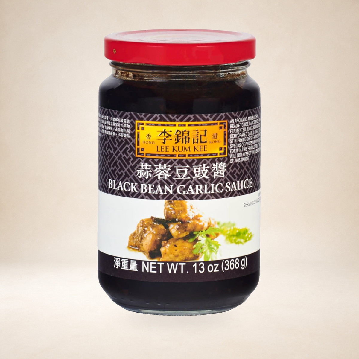 Lee Kum Kee Black Bean & Garlic Sauce 368g on a warm studio background