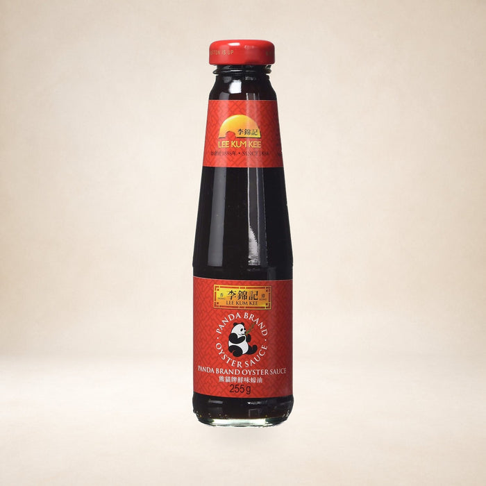Lee Kum Kee Panda Oyster Sauce 255g on a warm studio background