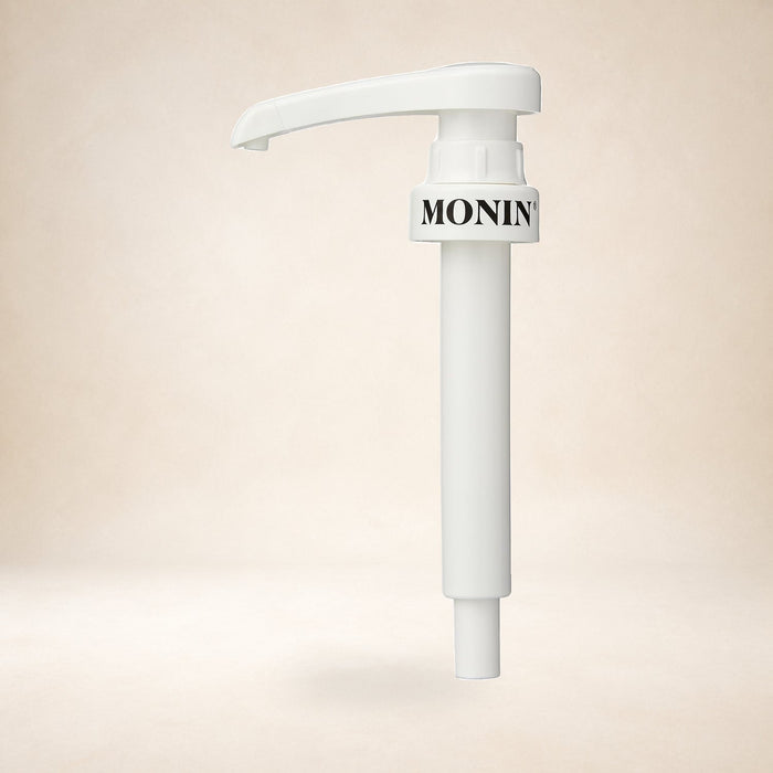 Monin 10ml Syrup Pump for 1L PET Bottles on a warm studio background
