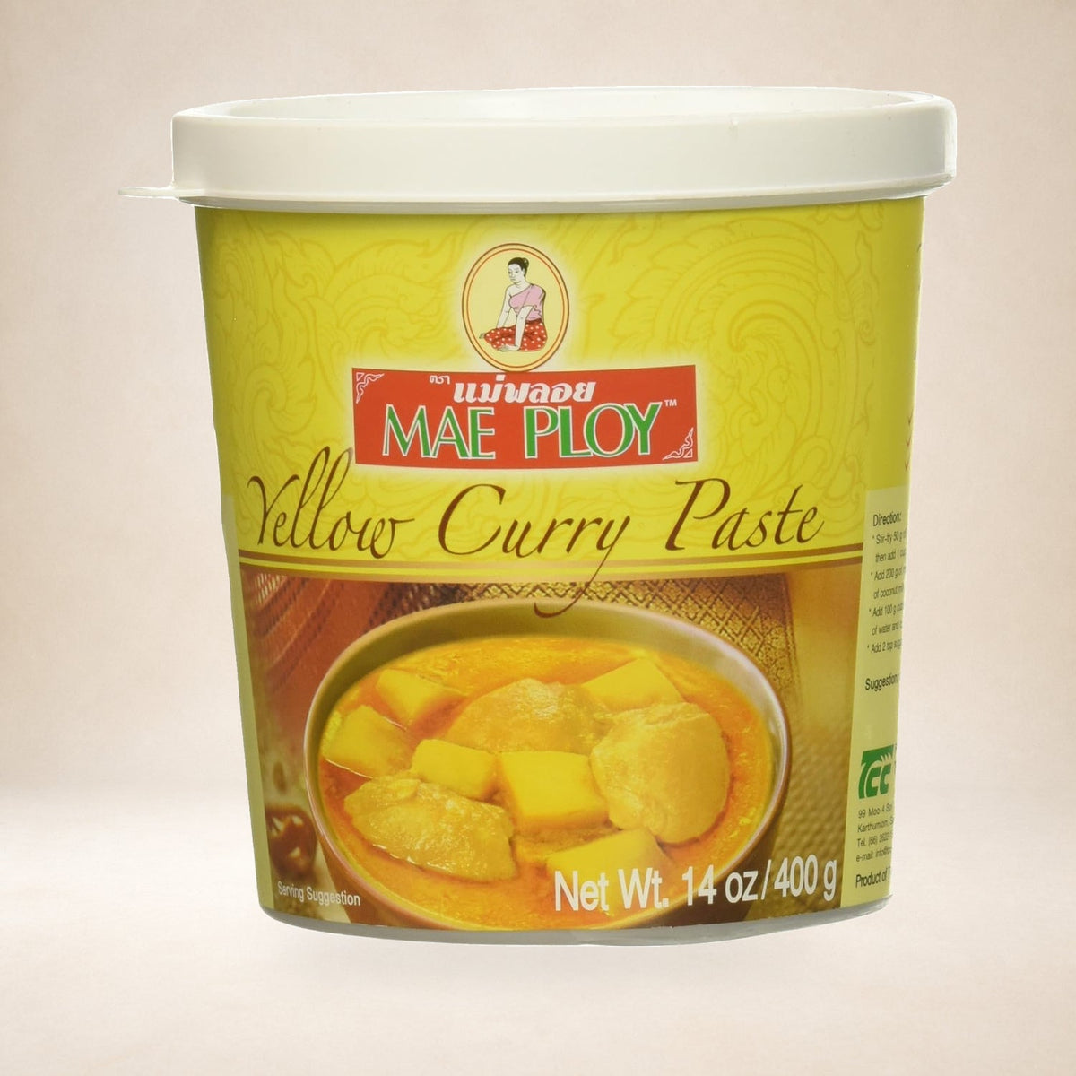Mae Ploy Yellow Curry Paste 400g on a warm studio background