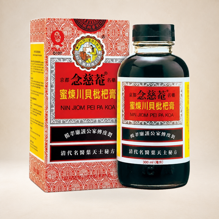 Nin Jiom Pei Pa Koa Cough Syrup 300ml on a warm studio background