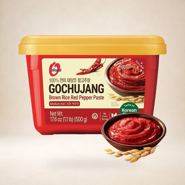 O'Food Medium Hot Gochujang Pepper Paste 500g on a warm studio background