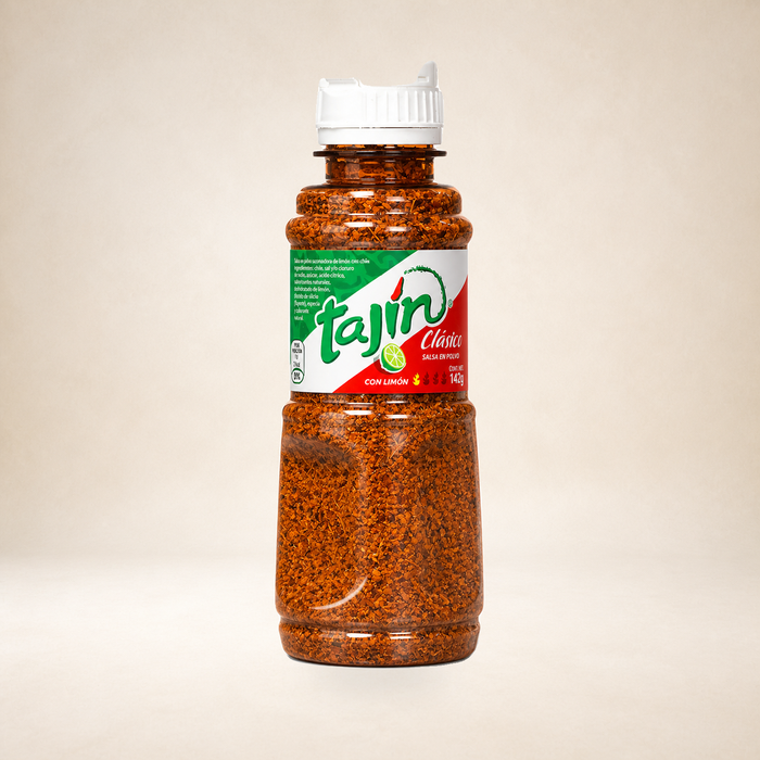 Tajín Clásico Seasoning 142g on a warm studio background
